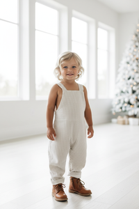 Boy portrait in Grady romper with boots